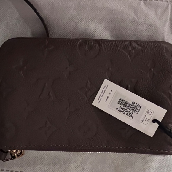 Louis Vuitton LV Monogram Empreinte Leather Wristlet - Picture 9 of 10